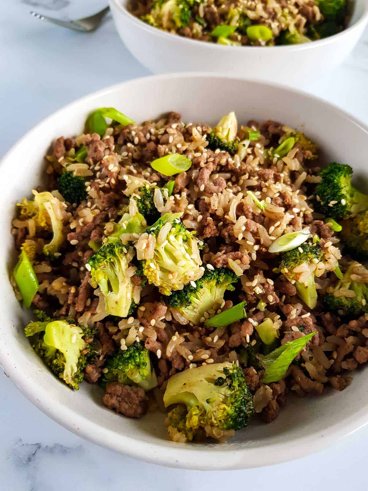 Ground beef and broccoli stir fry in a bowl.