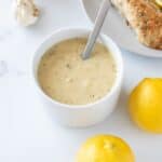 Lemon garlic sauce with lemon on the side.